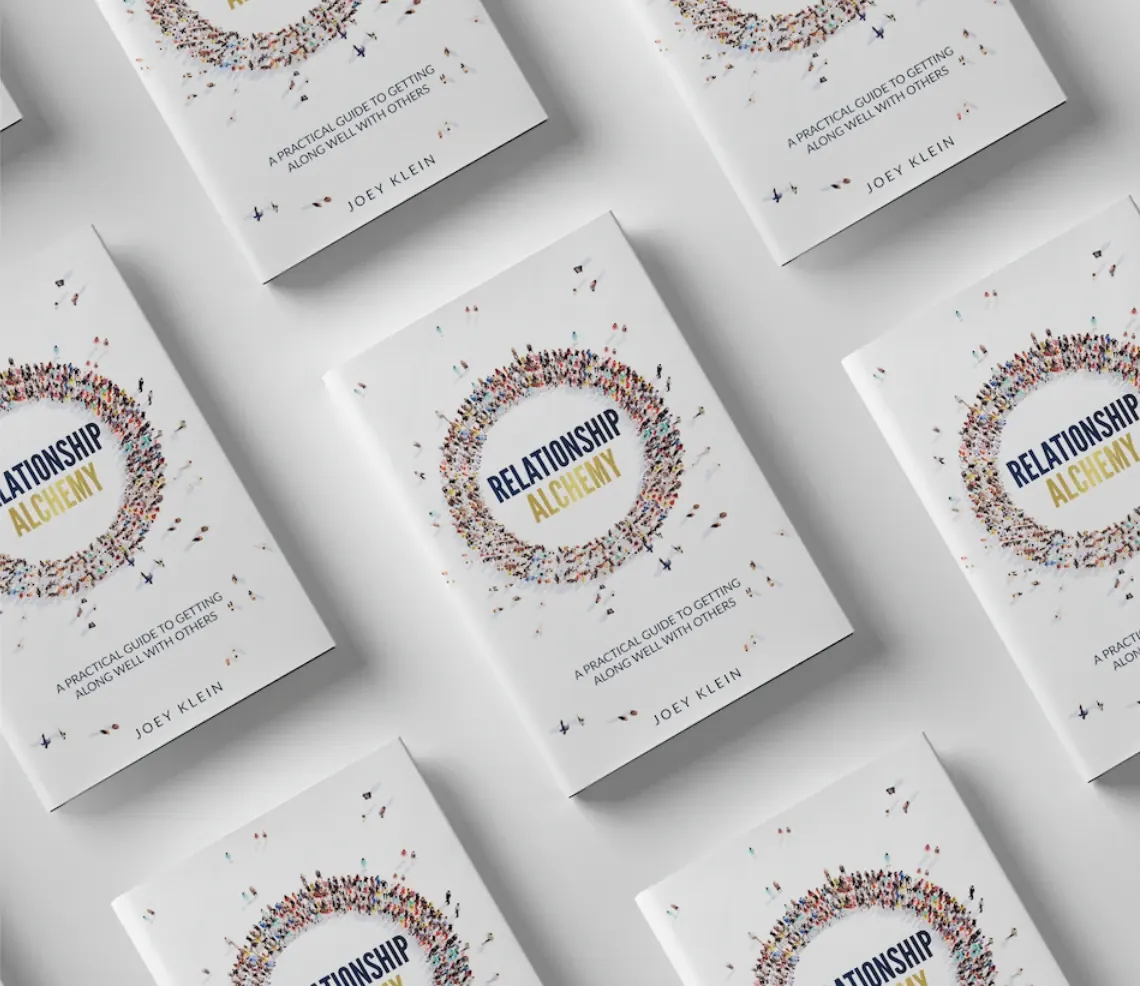 Paperback copies of Relationship Alchemy by Joey Klein