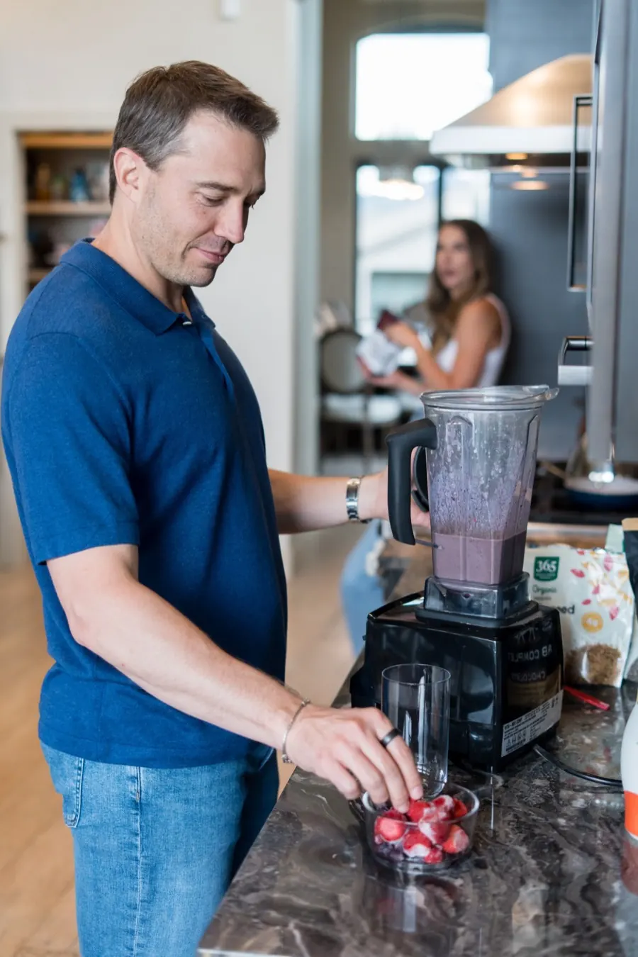 Joey Klein and his wife together in their kitchen on an ordinary morning